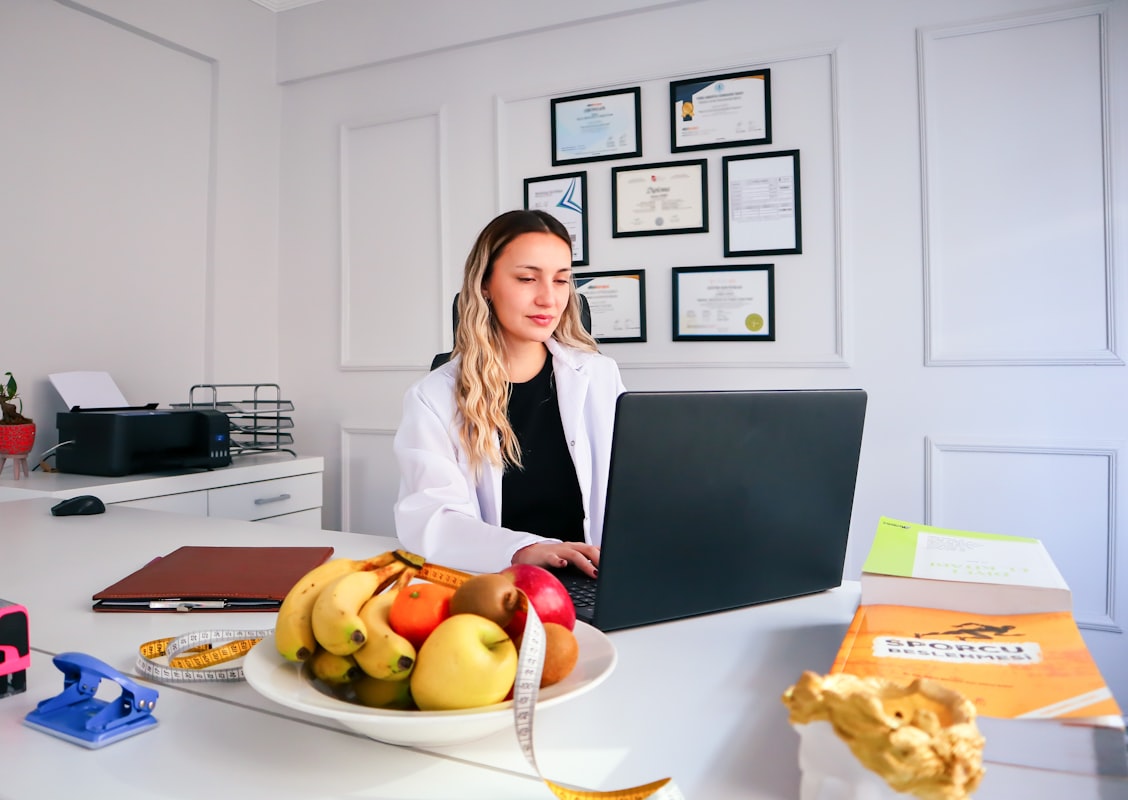 Nutritionist analyzing dietary information at desk